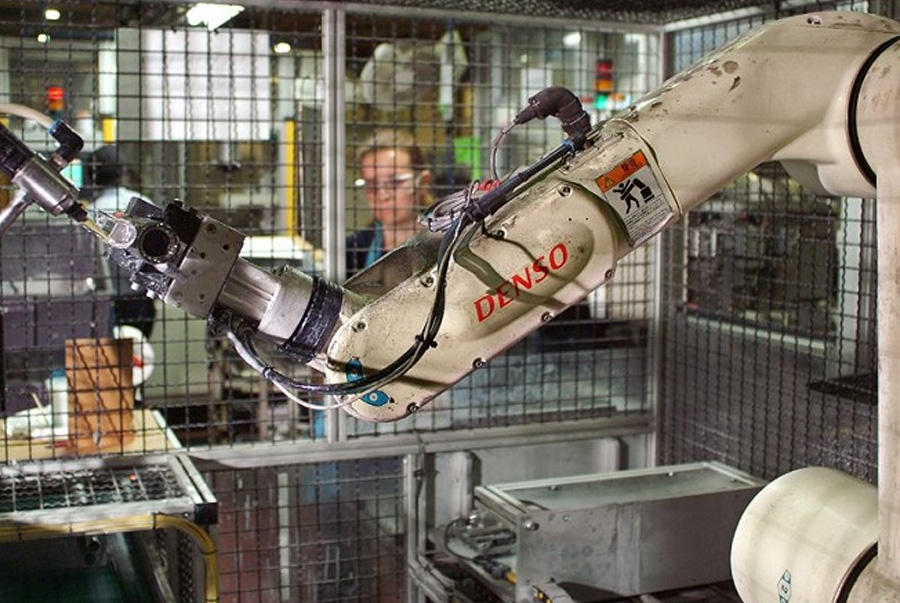 Denso robot arm in a factory