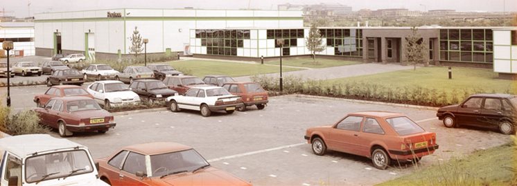 A historical picture of Routeco's former building and car park